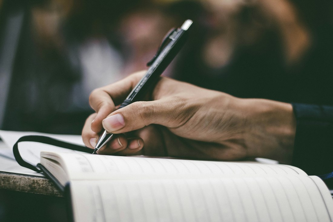Hand Writing in Notebook