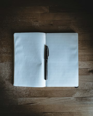 Blank Notebook and Pen