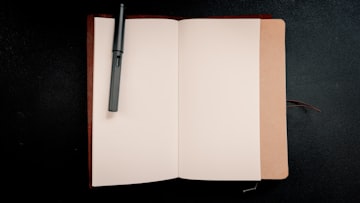 Open Notebook with Pen