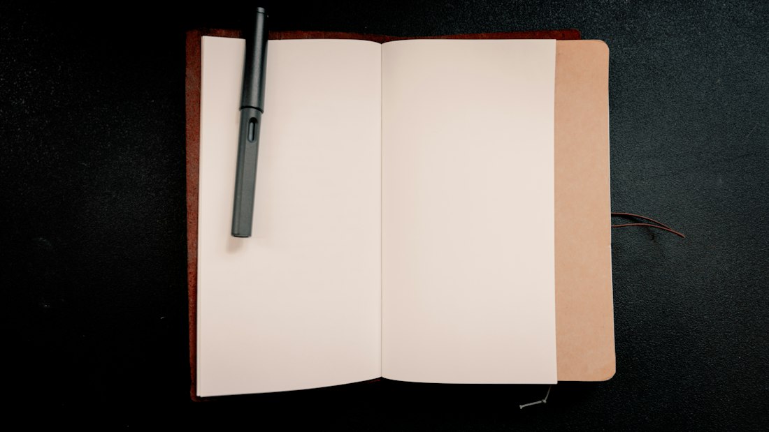 Open Notebook with Pen