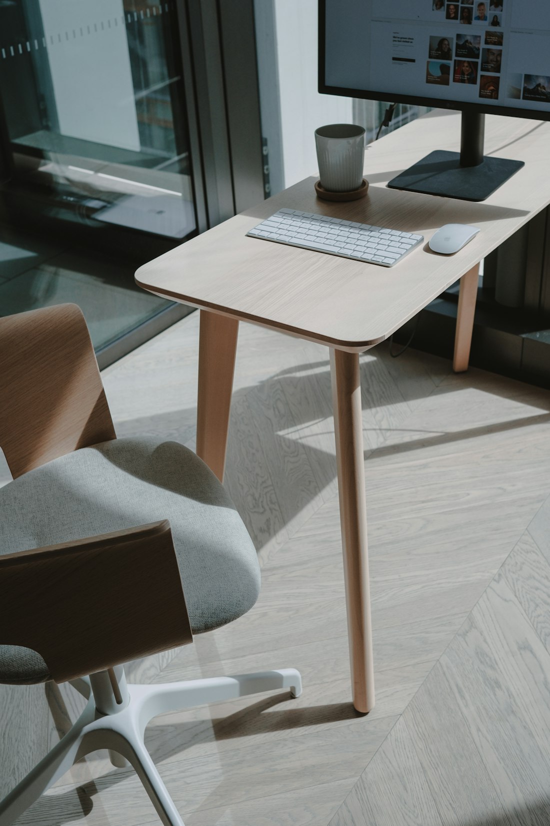 A tidy desk beside a window